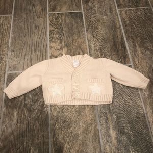 Knit newborn cardigan with star pockets